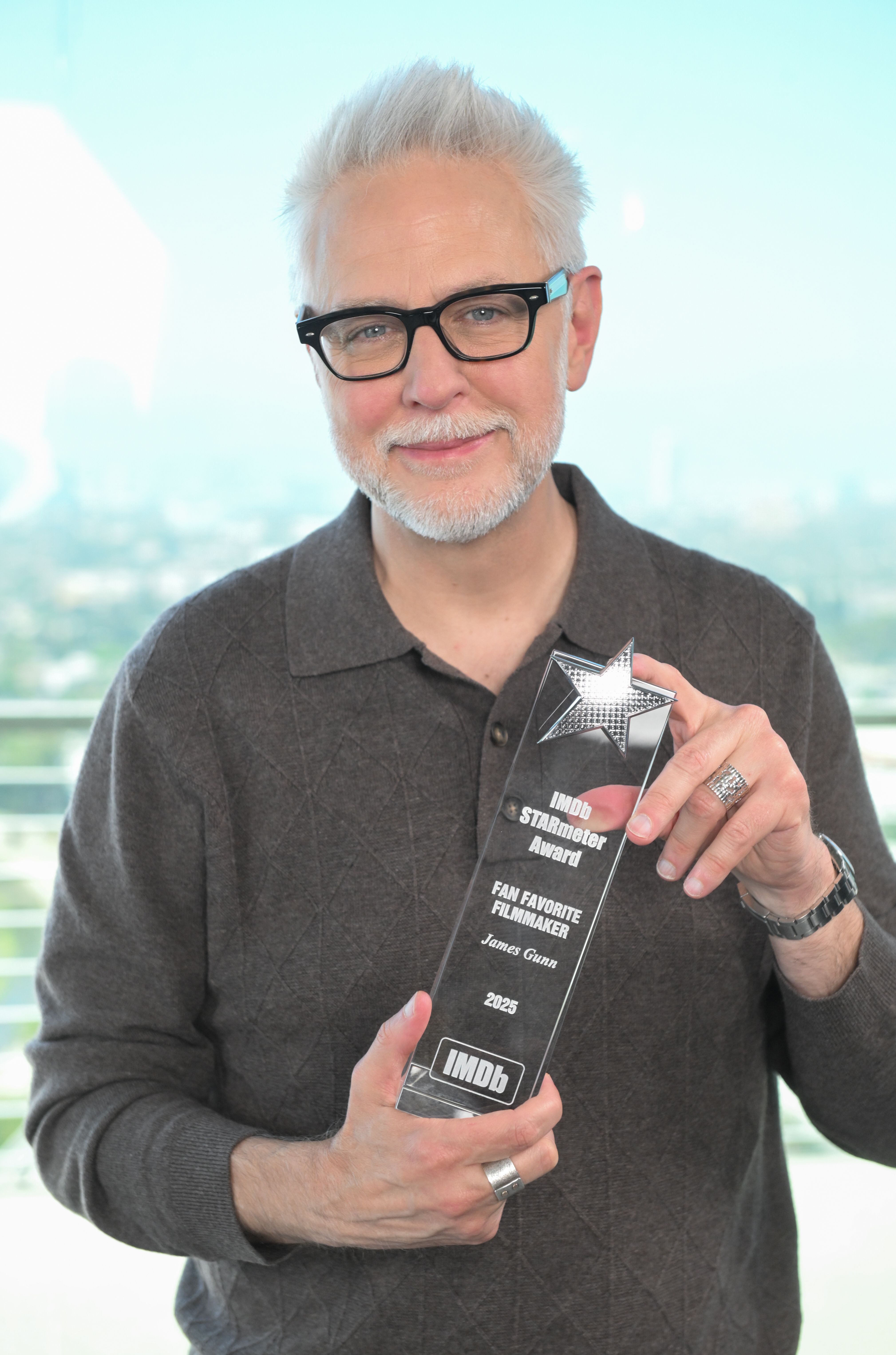 James Gunn holding his IMDb Fan Favorite Filmmaker award