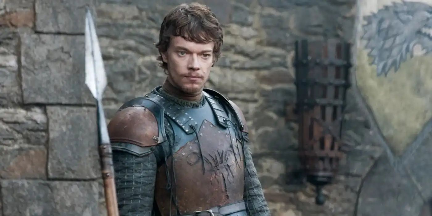 Theon Greyjoy stands in the courtyard of Winterfell with a spear