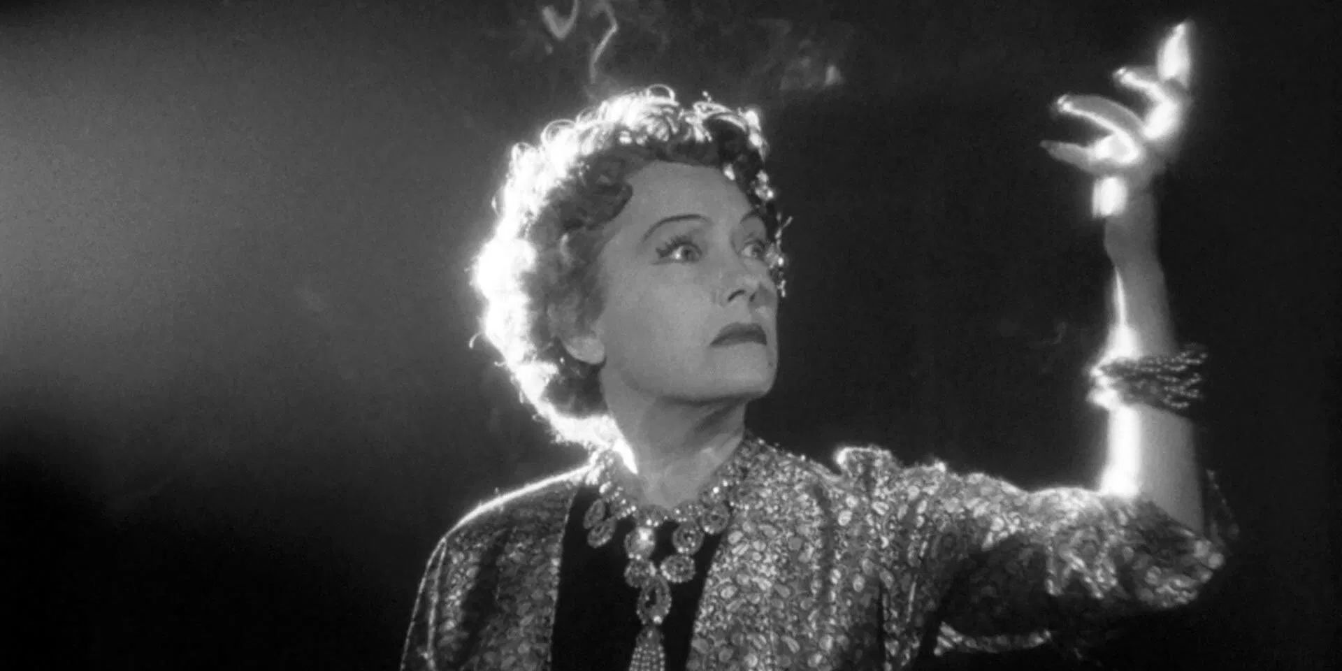 Gloria Swanson dramatically gestures while raving about her former stardom in Billy Wilder's 'Sunset Boulevard'