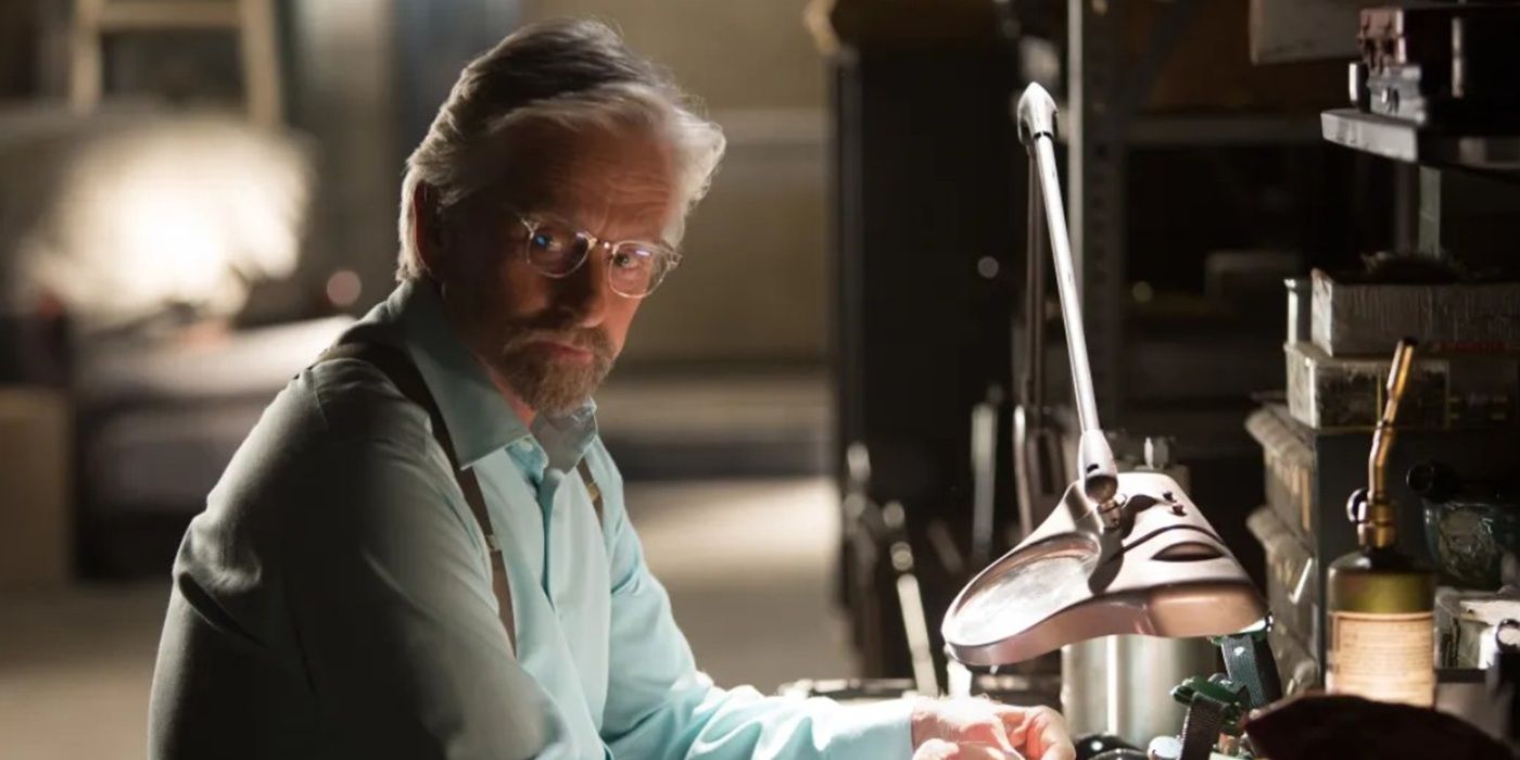 Michael Douglas as Hank Pym in Ant-Man and the Wasp sitting at a desk and looking behind.