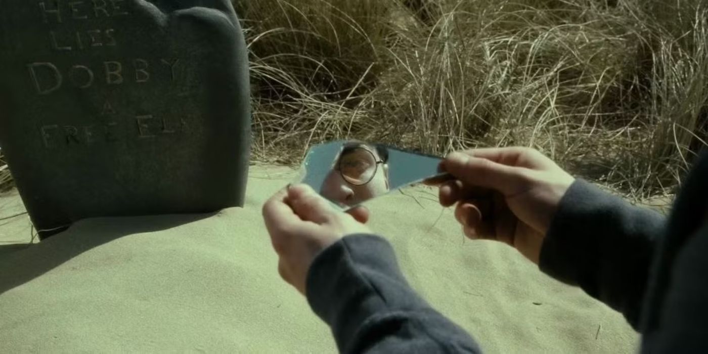 Harry Potter looking at a shard of mirror in Deathly Hallows Part 2.