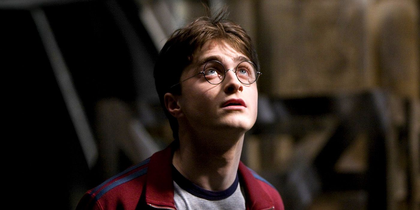 Daniel Radcliffe as Harry Potter looking up at something off-screen in the Harry Potter film series.