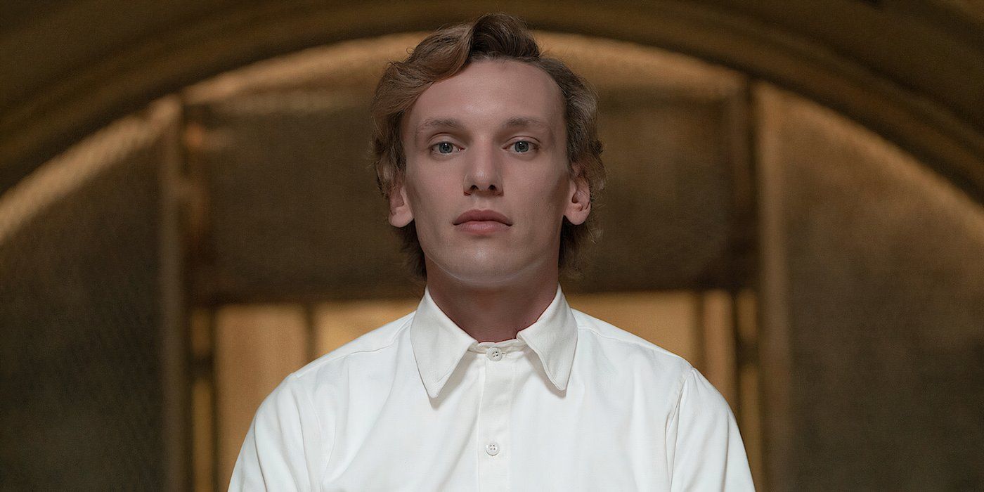 Number One in the smirking slightly and gazing forward in the series Stranger Things.