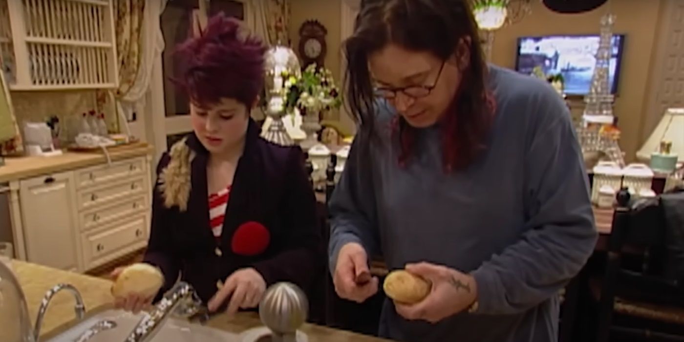 Kelly Osbourne and Ozzy Osbourne peeling potatoes in 'The Osbournes'