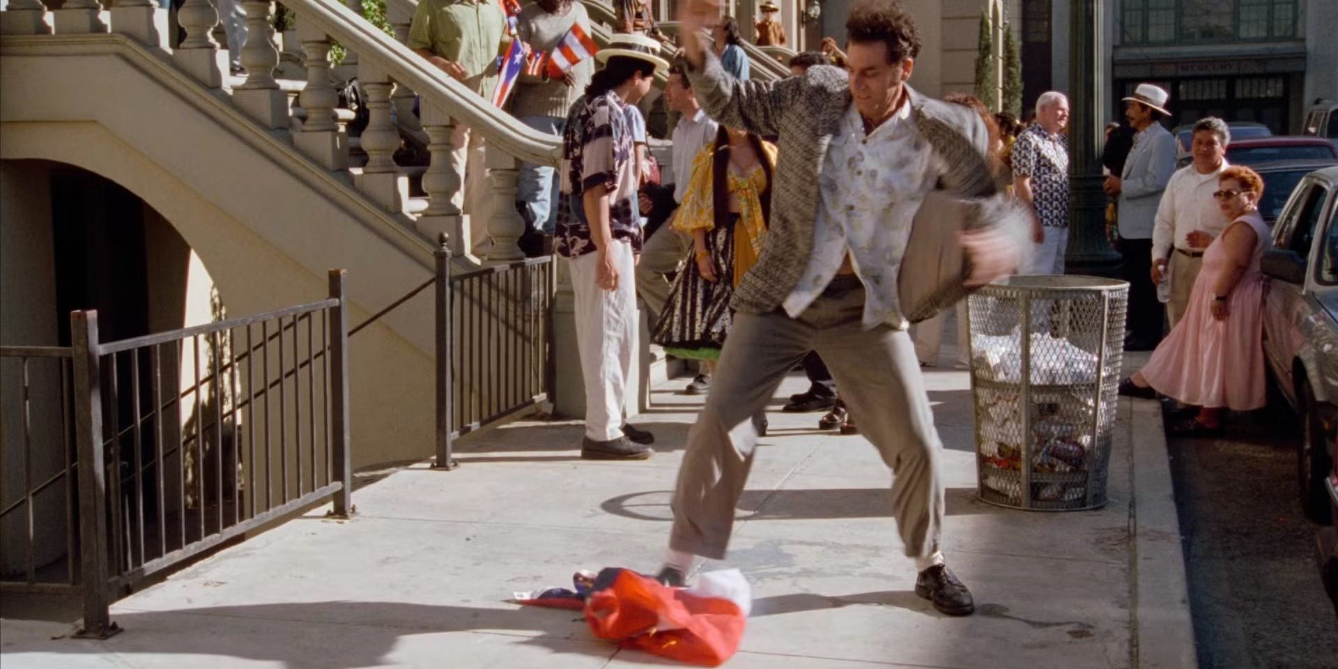 Michael Richards as Kramer tries to put out a burning Puerto Rican flag by stomping on it in Seinfeld.