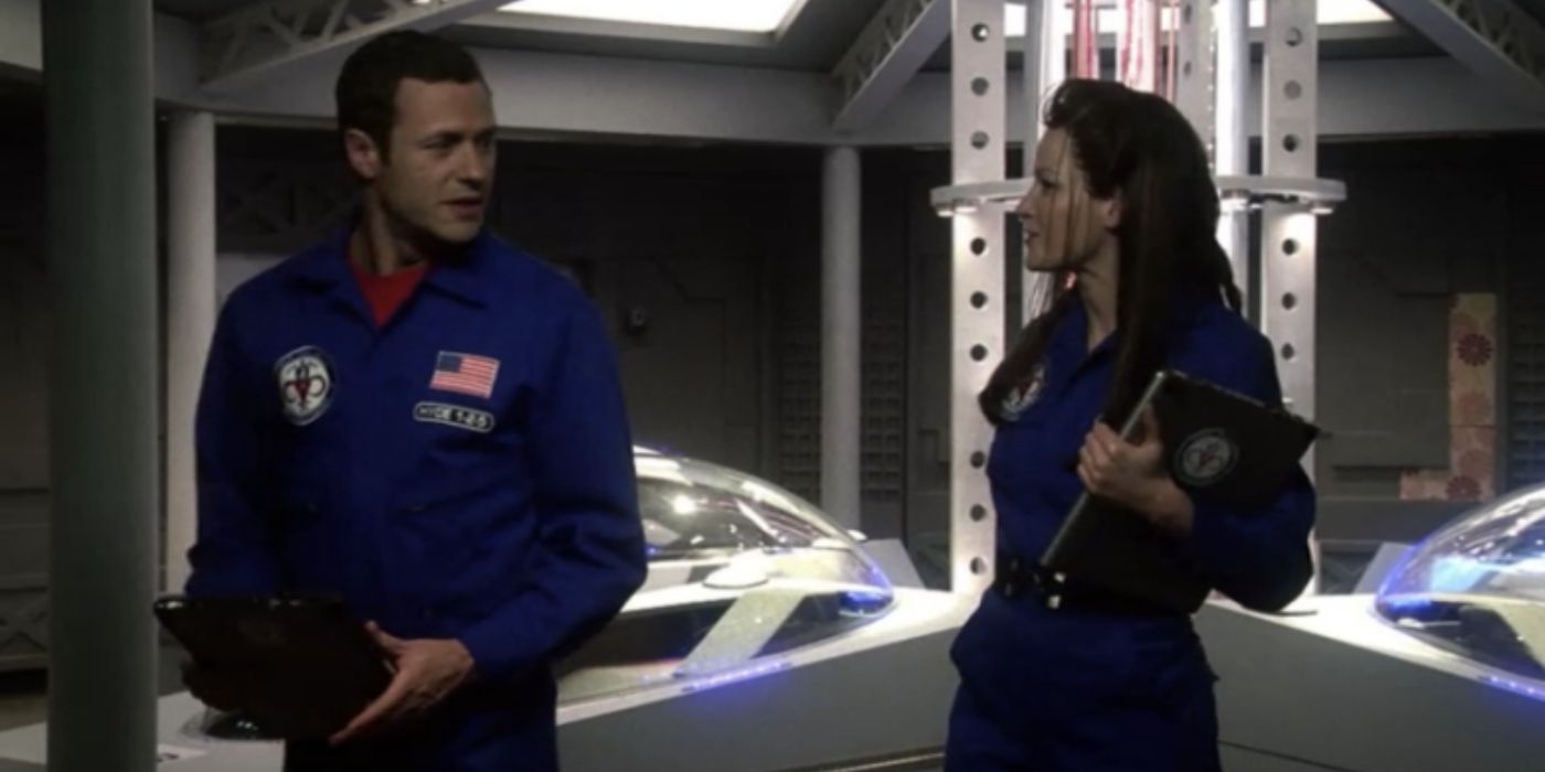 Two people in space uniforms talking in the Life on Mars finale.