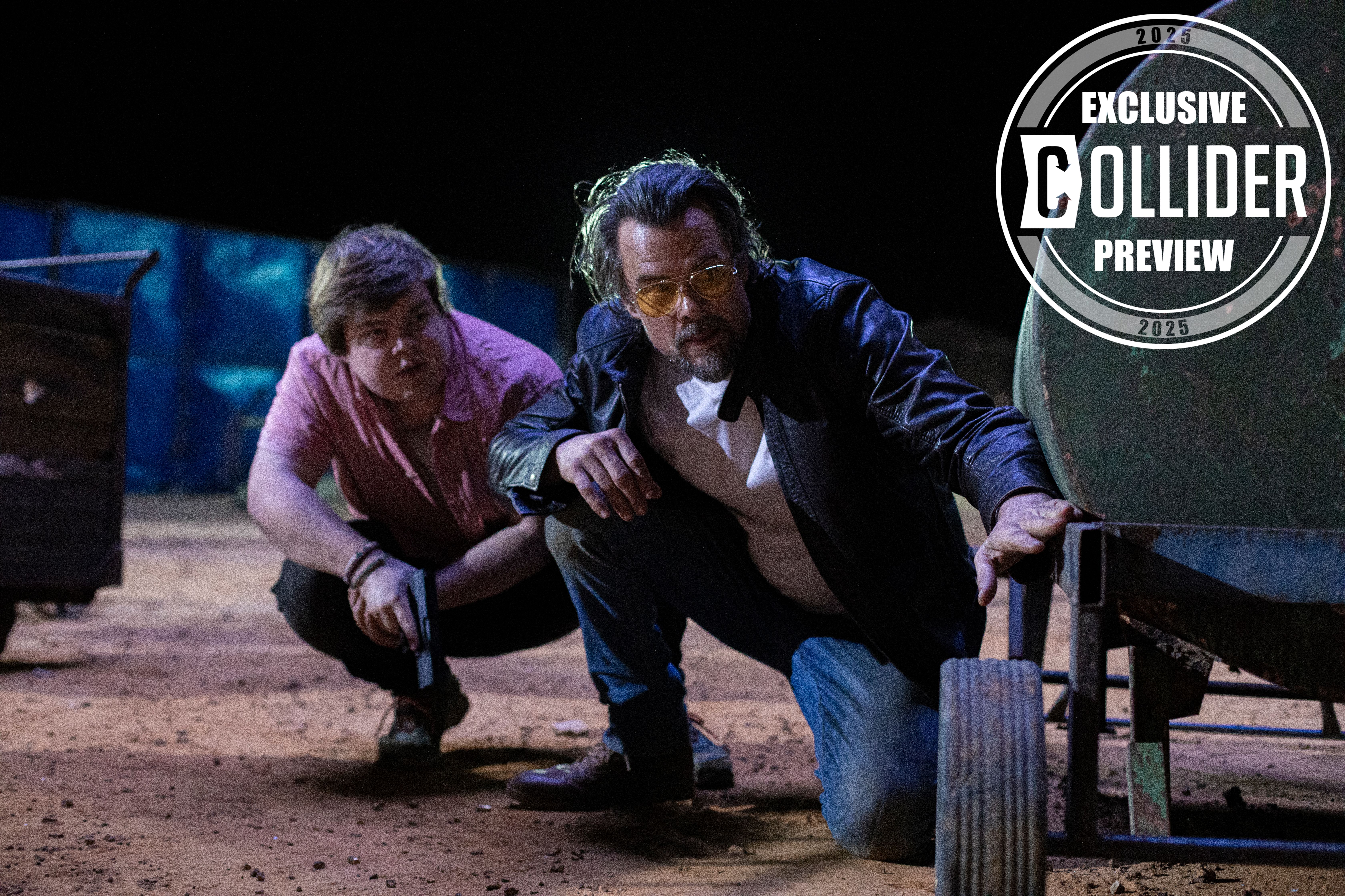 Jeremy Ray Taylor and Josh Duhamel crouching with guns in LONDON-CALLING