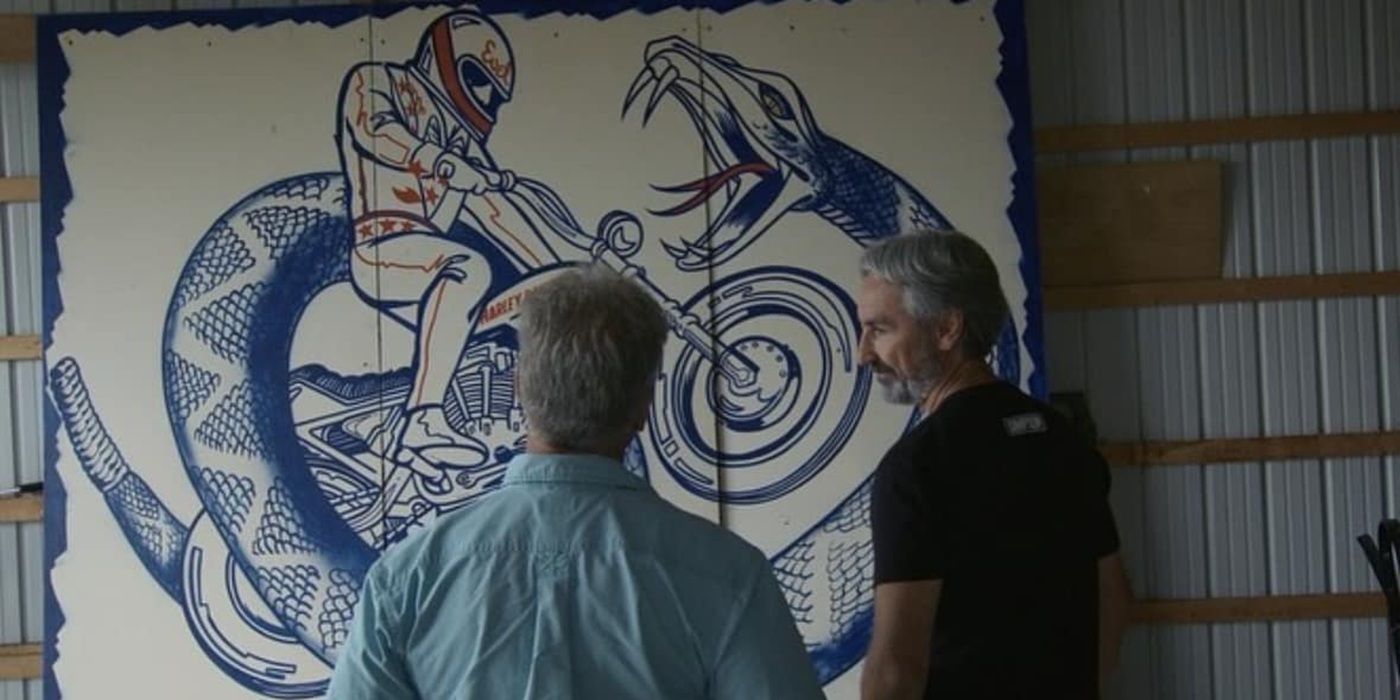 Mike Wolfe looking at the Snake River Canyon poster