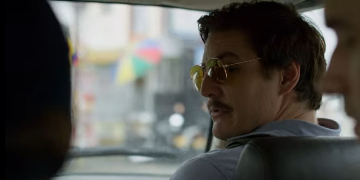 Pedro Pascal wearing vintage glasses and looking backwards in Narcos, "Checkmate"