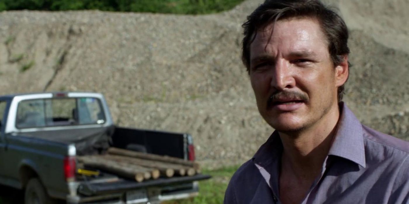 Pedro Pascal looking disgusted in front of a truck with logs in Narcos, "Going Back to Cali"