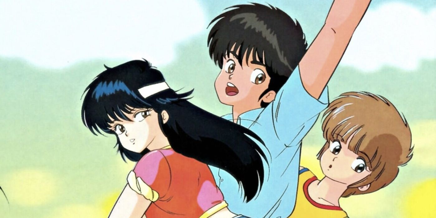 Two boys and a girl look back over their shoulders in the anime Kimagure Orange Road.