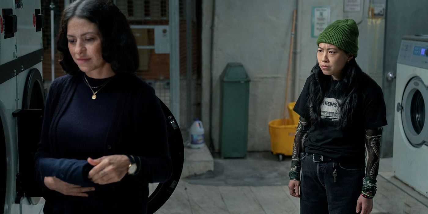 Alia Shawkat as Amelia Peek and Awkwafina as Maddy Saint Maire by laundry machines in Season 2 of Poker Face.