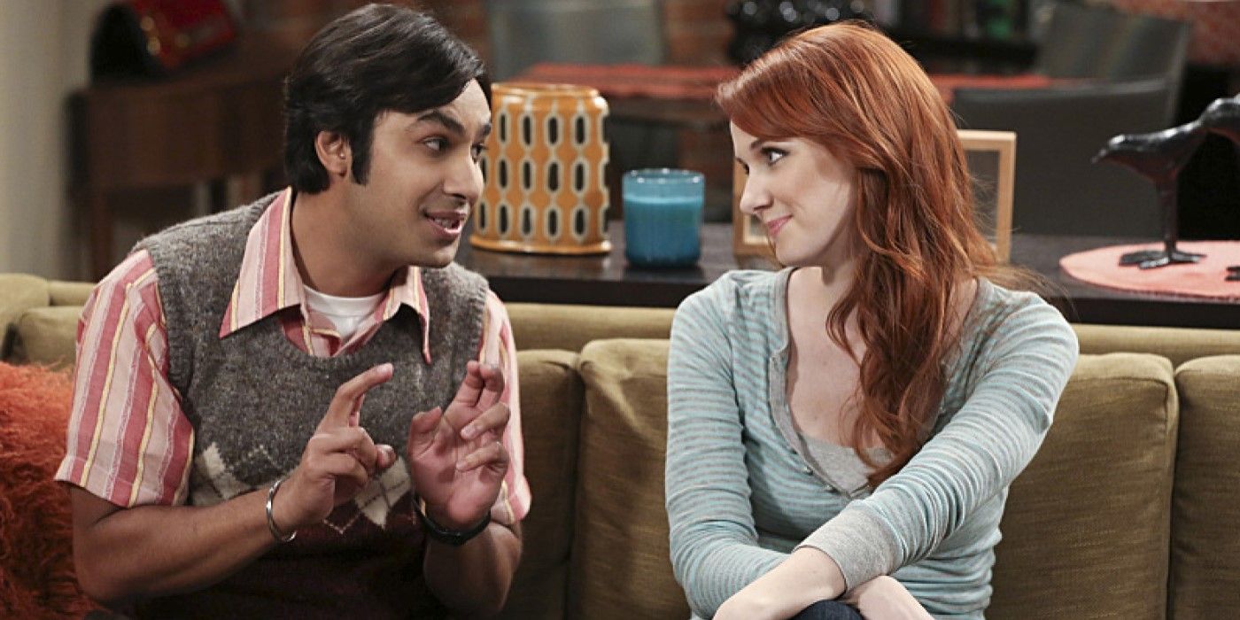 Raj (Kunal Nayyar) and Emily (Laura Spencer) sitting together on a couch in The Big Bang Theory.