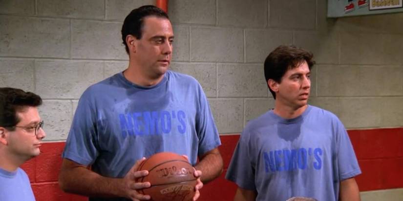 Robert, Ray, and Andy with a basketball in Everybody Loves Raymond.