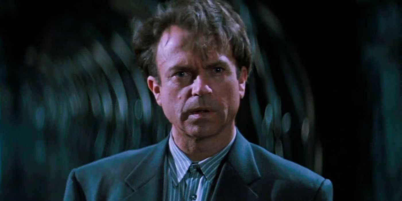 John looks at Sutter Cane with confusion in In the Mouth of Madness.