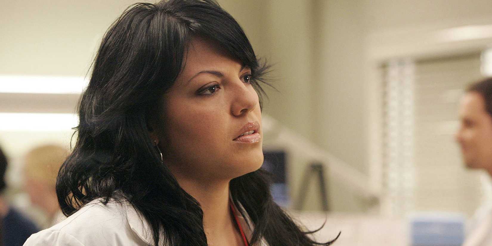 Sara Ramirez as Dr. Callie Torres looking tired in Grey's Anatomy.