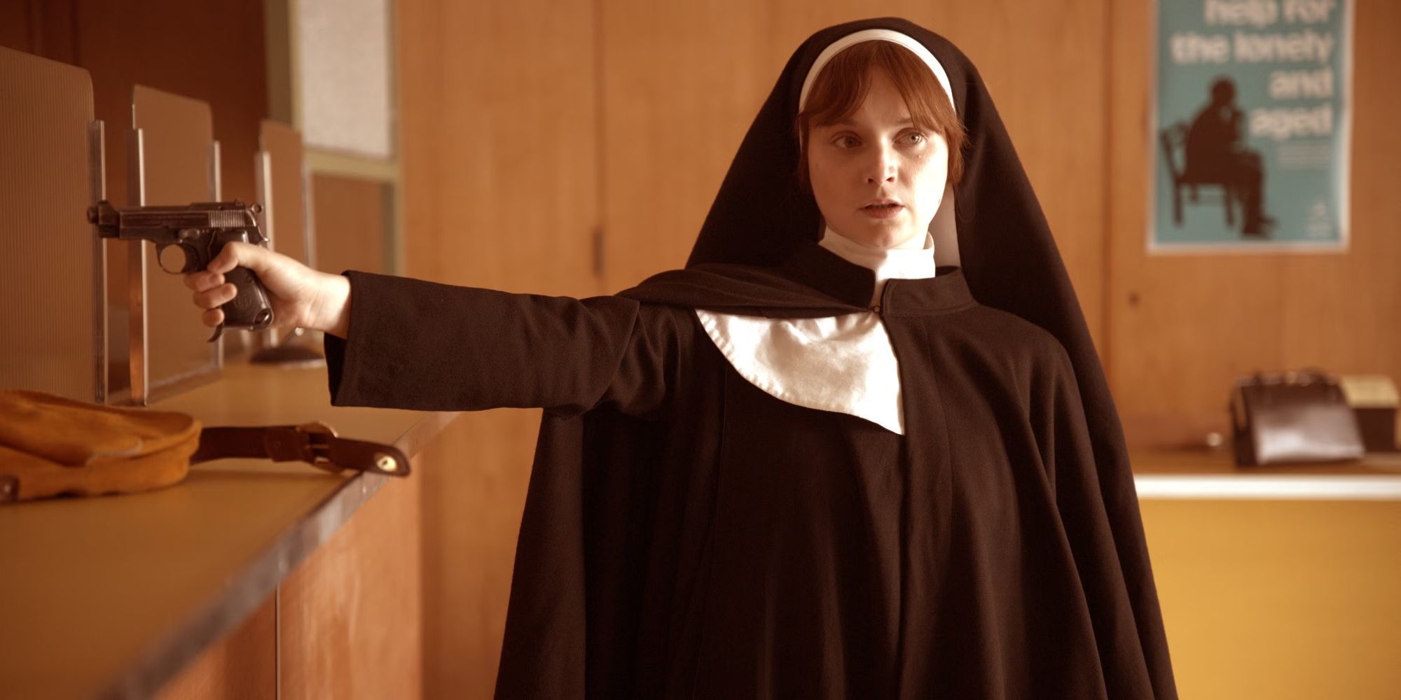 Lola Petticrew as Dolours in a nun outfit holding out a gun with her right hand in Say Nothing.