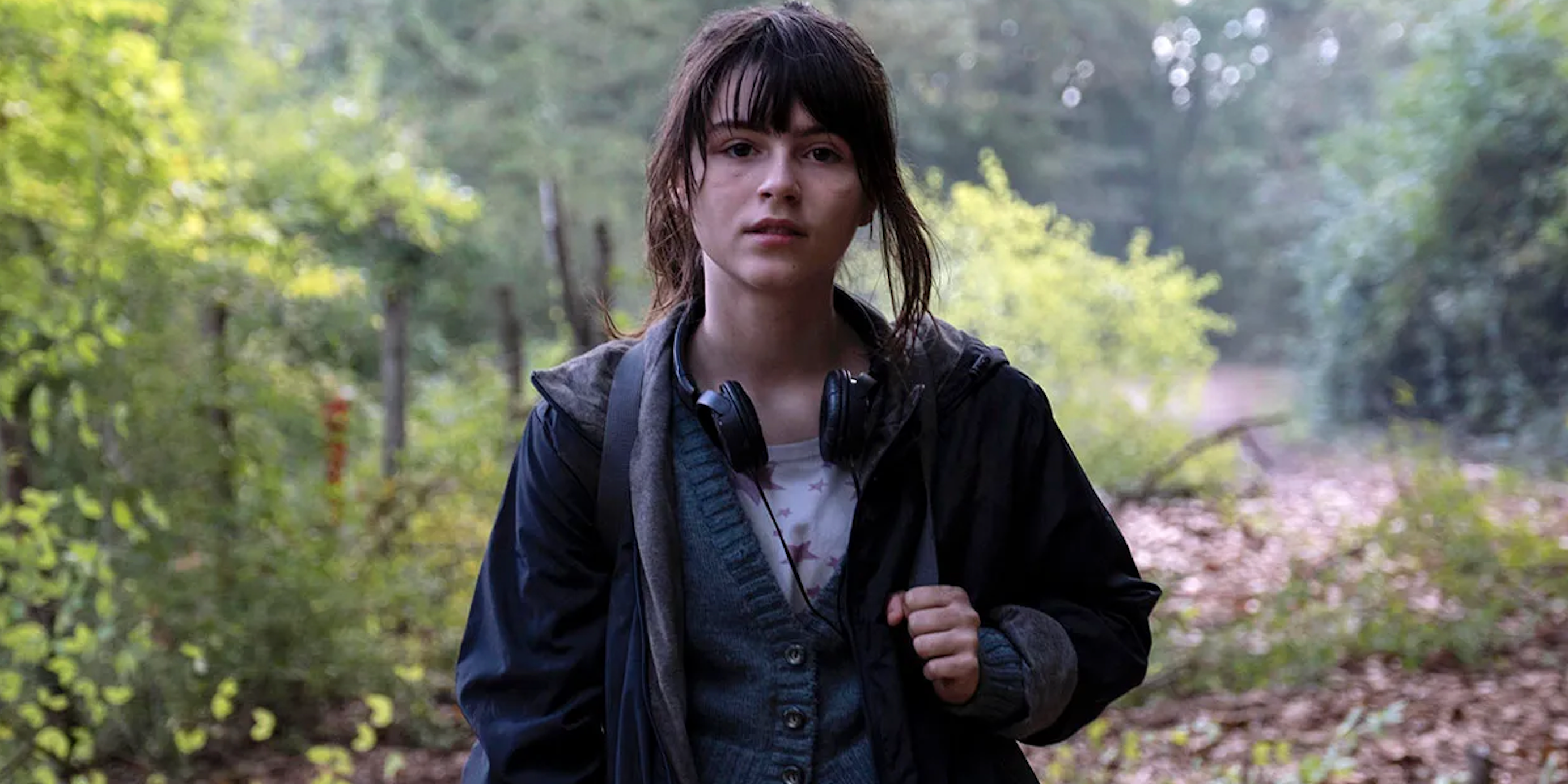 Anna stands in woods in 'Anna.'