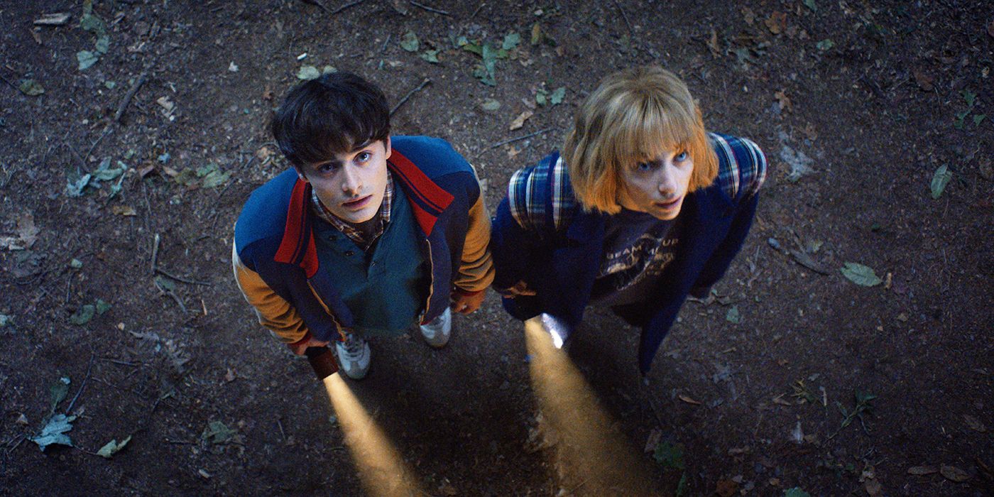Will Byers and Robin Buckley standing outside and holding flashlights in the trailer for Stranger Things Season 5