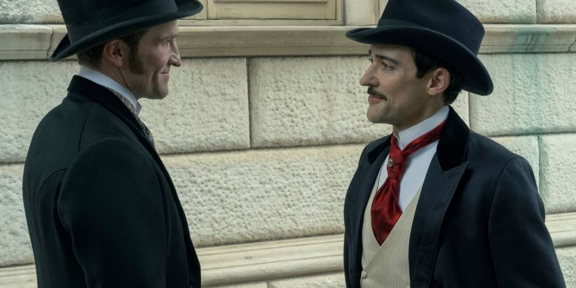 Blake Ritson and Claybourne Elder smiling and talking on a street in The Gilded Age Season 3, Episode 6.