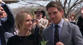 Brittany Snow as Sophie standing side by side with Evan Jonigkeit as Graham in The Hunting Wives
