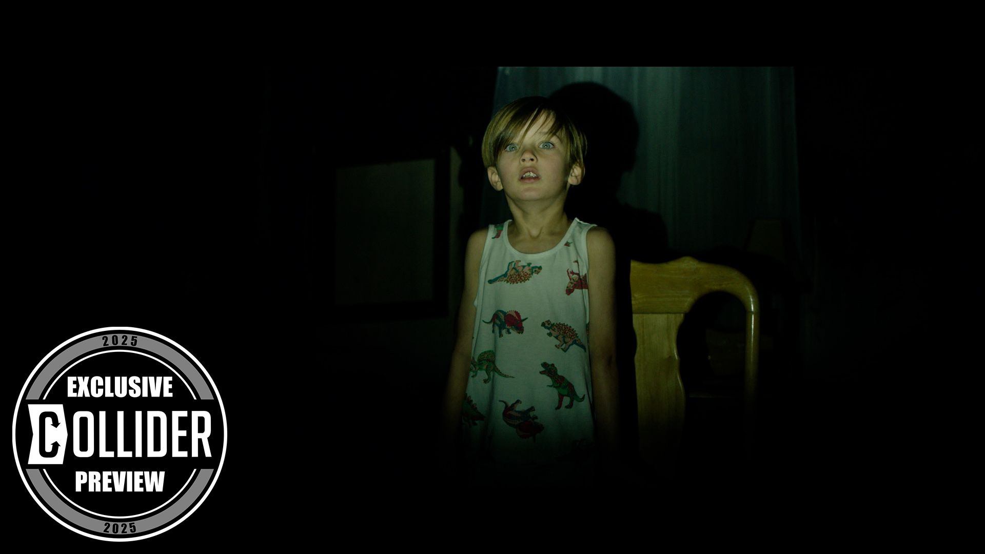 A scared child lit by a hallway light in the dark in Traumatika