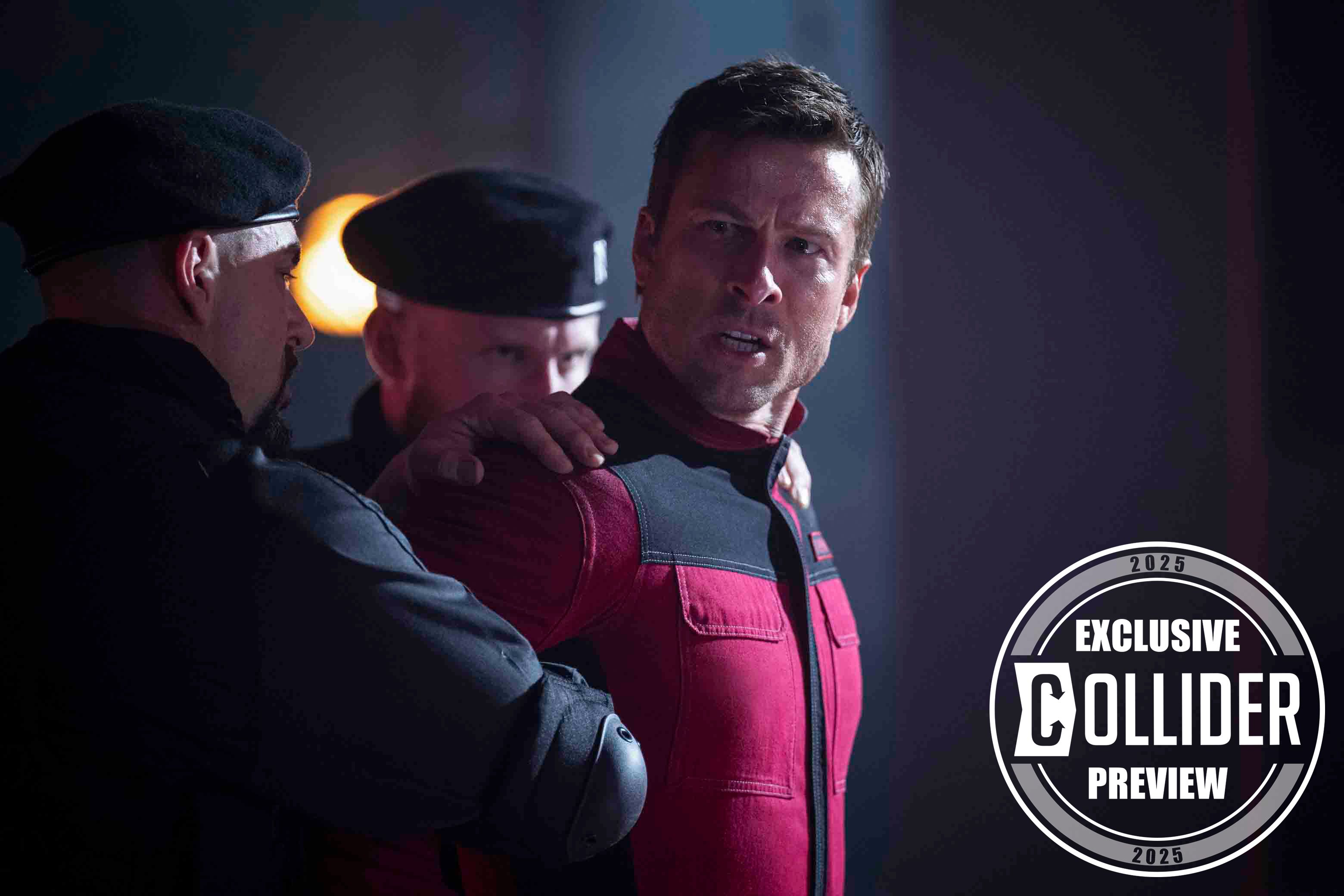 Glen Powell being held by two men in The Running Man