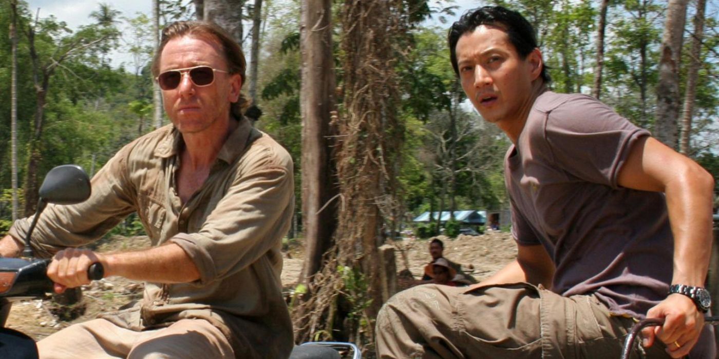 Two people on all-terrain vehicles look to the distance in Tsunami: The Aftermath, 2006.