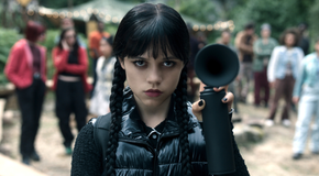 Jenna Ortega as Wednesday Addams holding an air horn in Wednesday Season 2.