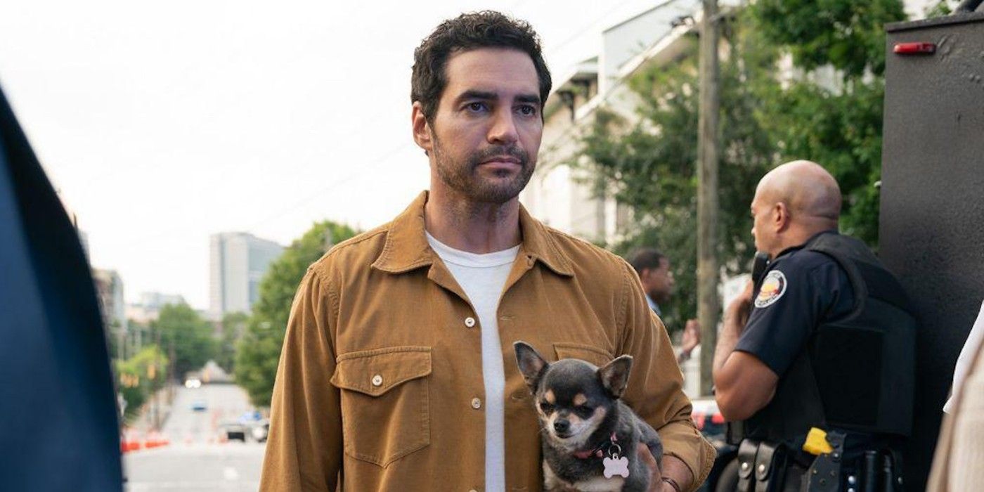 Will Trent holding his dog Betty in Will Trent Season 3