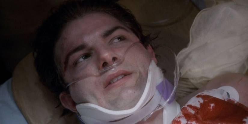 David (Adam Scott) looking to the side while stuck in a neck brace