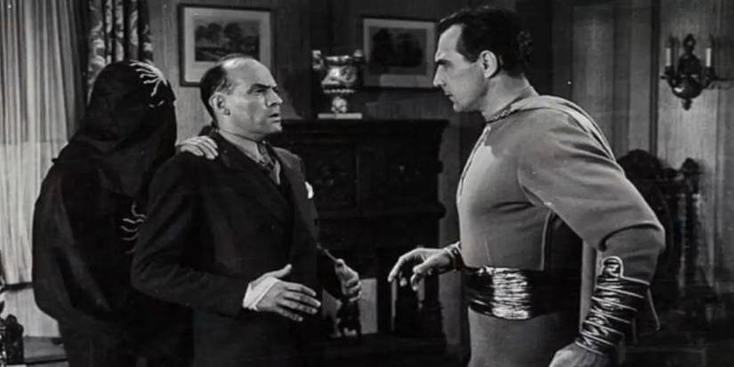 Captain Marvel faces a man and a person in black robes in Adventures of Captain Marvel.