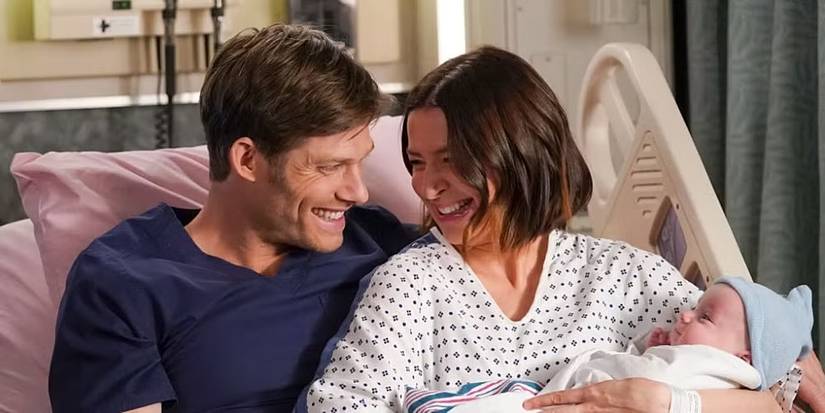 Amelia and Link holding their newborn son in Grey's Anatomy  