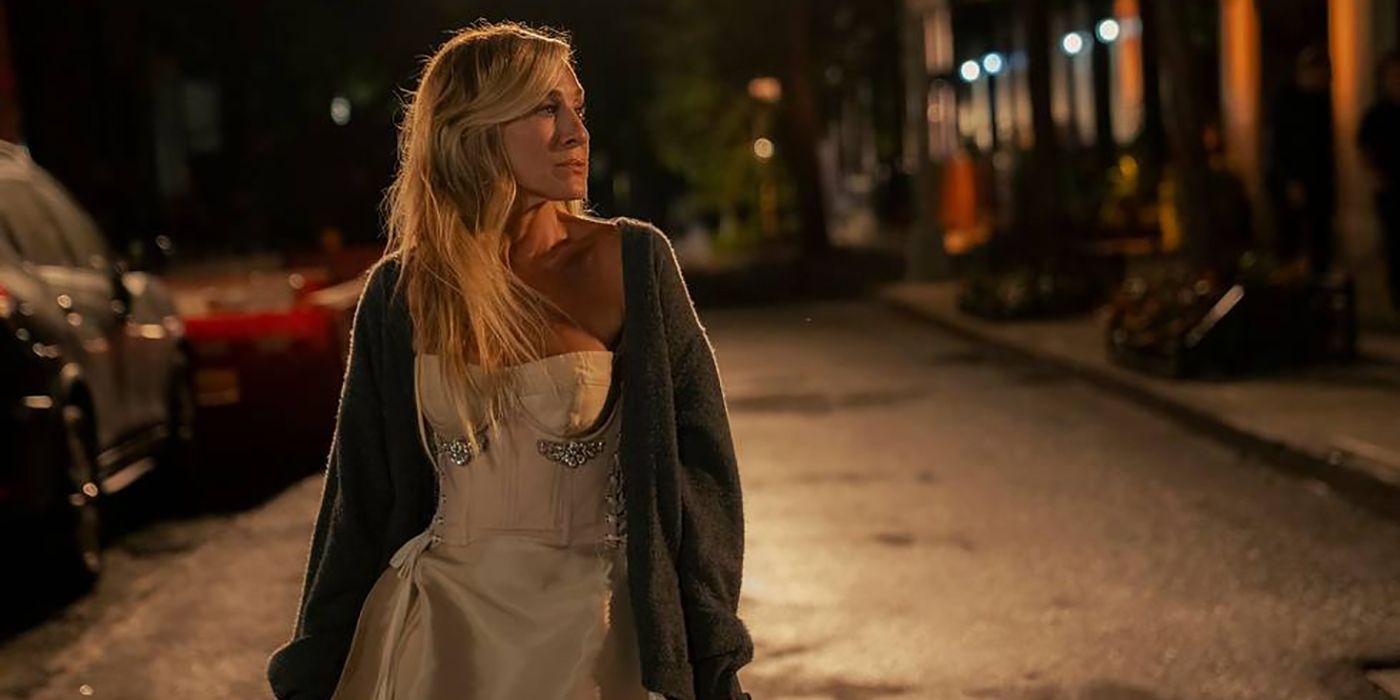 Carrie walking down the street at night in And Just Like That...