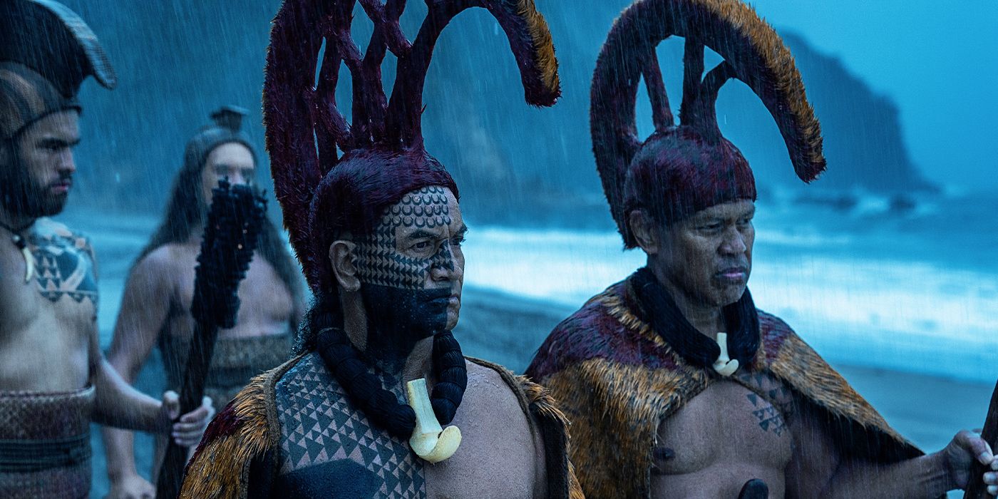 Temuera Morrison and Ocean Kaowili leading warriors on a beach in the rain in Chief of War
