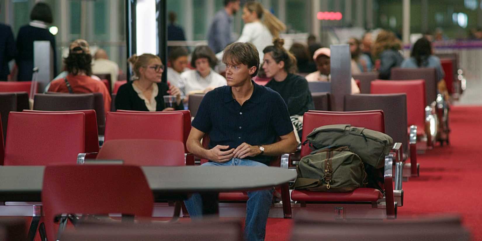 Conrad Fisher seated at the airport in summer, I became a nice season 3