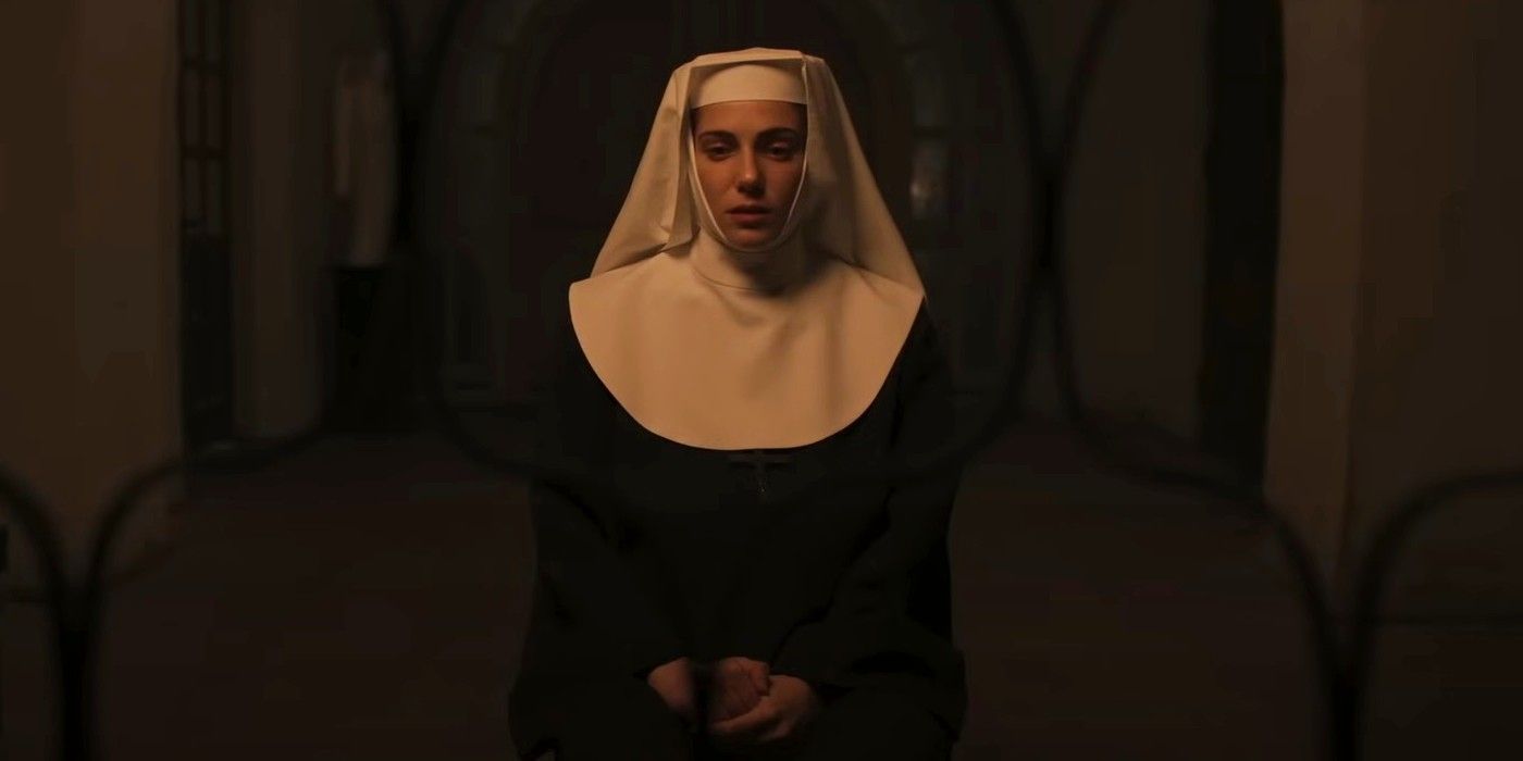 Maria-Vera-Ratti as Sister Yulia wearing a nun's habit, sitting behind a gate in a convent in 'Deliver Us'.
