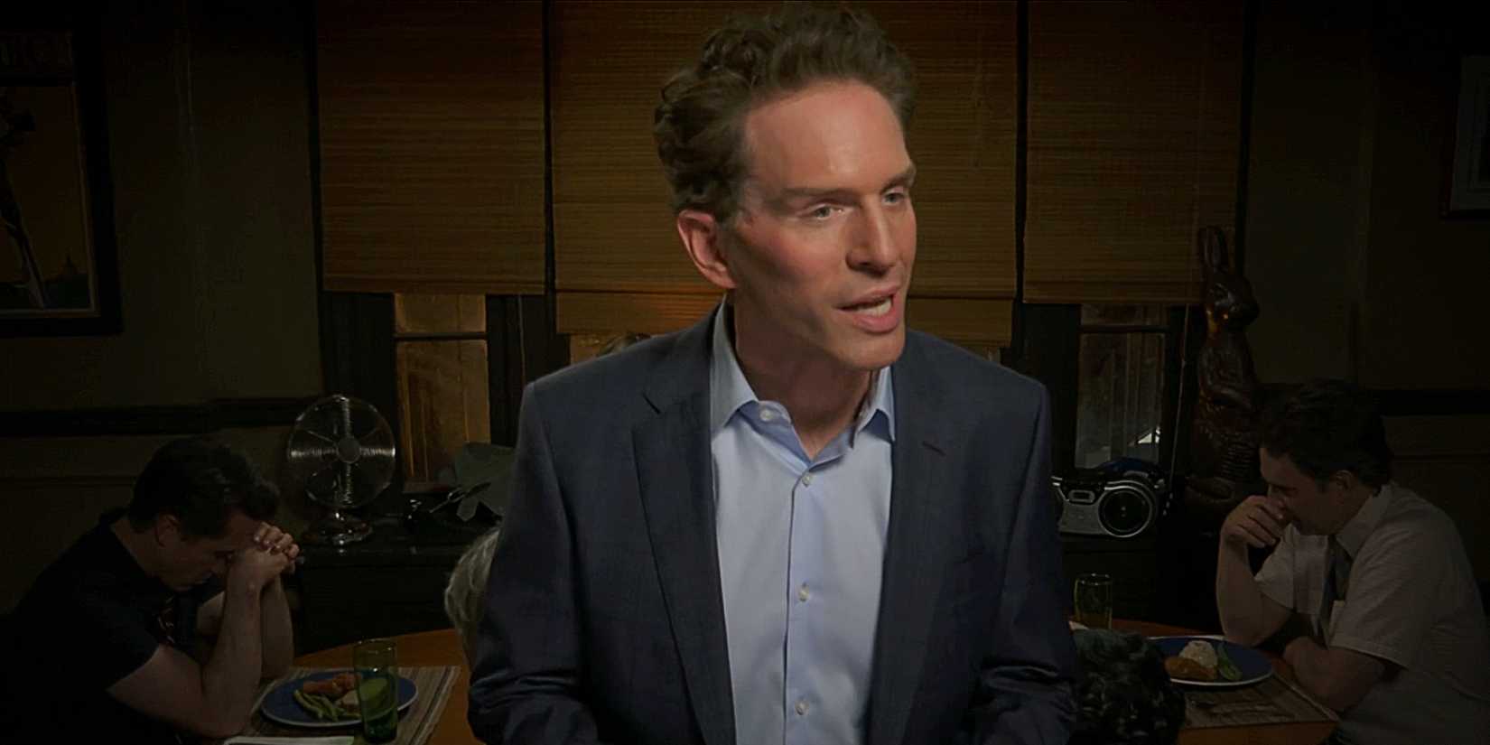 Dennis Reynolds smiling while wearing face tape in It's Always Sunny in Philadelphia Season 17.
