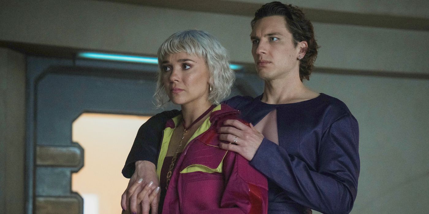 Toran Mallow standing behind Bayta and half-hugging her in Foundation Season 3 Episode 6