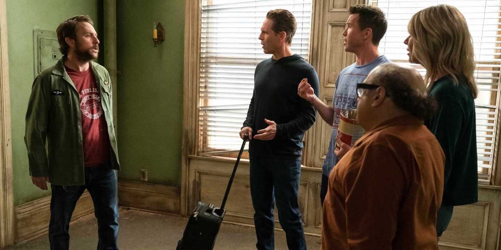 Charlie, Dennis, Mac, Frank, and Dee talking in a room in It's Always Sunny in Philadelphia Season 16.
