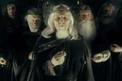 Eight cloaked men, standing in a chevron arrangement, each holding a gold ring in Lord of the Rings: The Fellowship of the Ring.