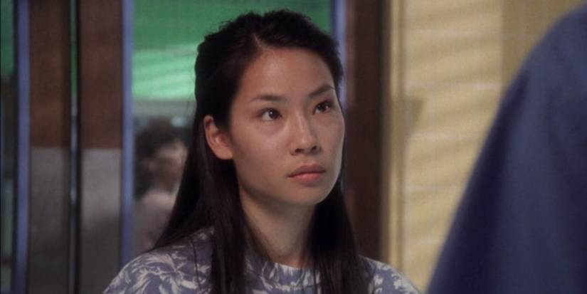 Mei-Sun (Lucy Liu) looking at a doctor while standing in a trauma room.