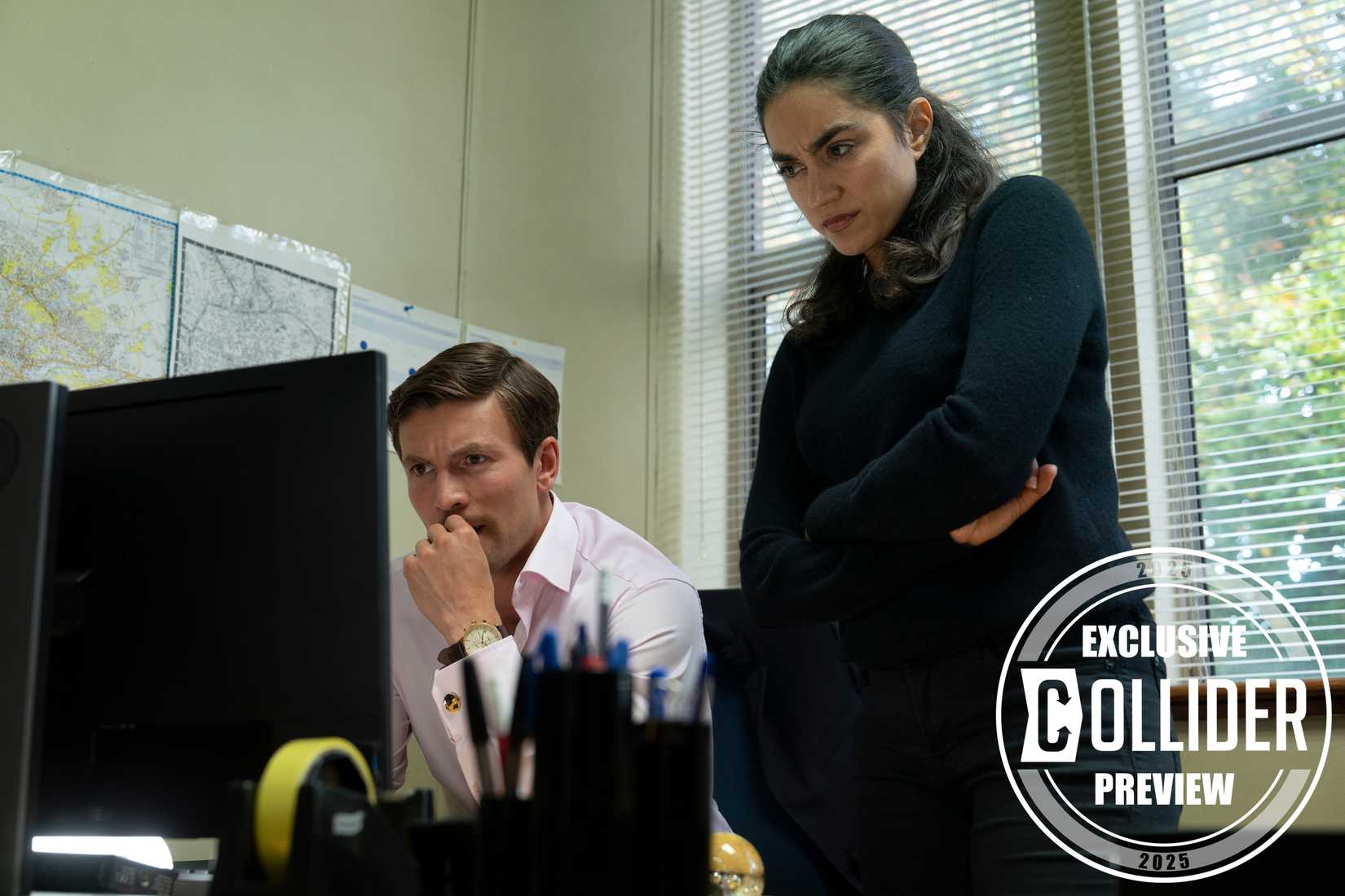 Leo Suter and Sofia Barclay looking at a computer in Lynley