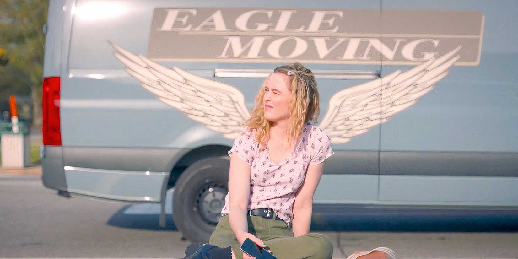 Kathryn Newton as Margaret in the sun with a truck with painted wings behind her in The Map of Tiny Perfect Things