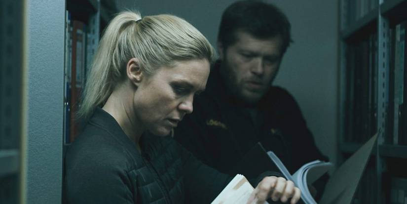 Nína Dögg Filippusdóttir as Kata in The Valhalla Murders going through case files with a colleague