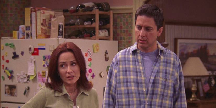 Patricia Heaton and Ray Romano standing side by side in The Disciplinarian on Everybody Loves Raymond.