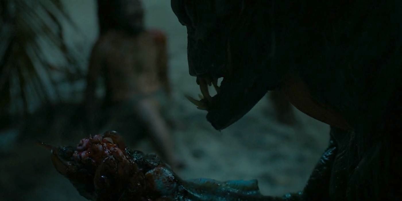 The folklore beast, the Orang Ikan (Alan Maxson), holds up the heart of a victim in Monster Island. 
