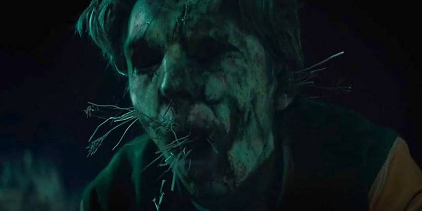 Tommy (Austin Abrams) transforms into a scarecrow in the 2019 horror film Scary Stories to Tell in the Dark.