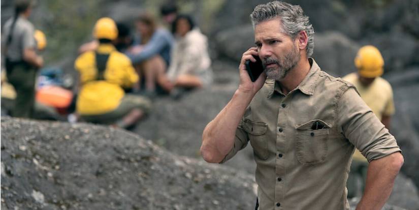 Eric Bana as Kyle wearing a brown shirt on the phone in 'Untamed'