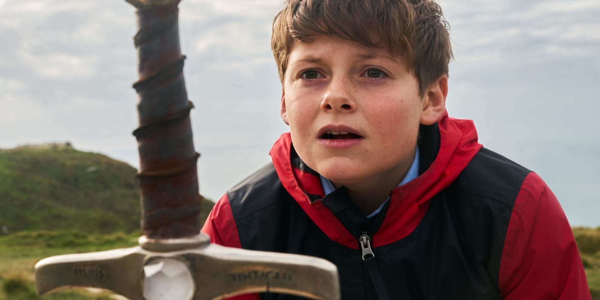 Alex looking at Excalibur in The Kid Who Would Be King.